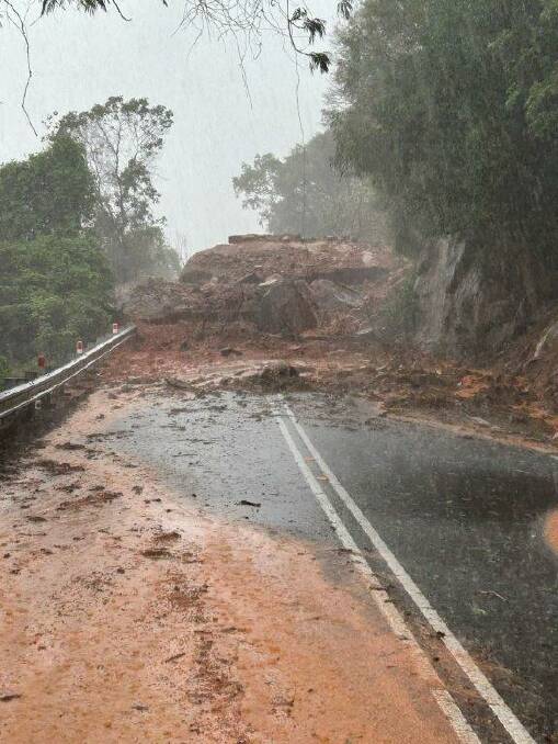 A landslide is one of many blockages on the Captain Cook Highway preventing farmers having their produce transported to Cairns. Picture: TMR 