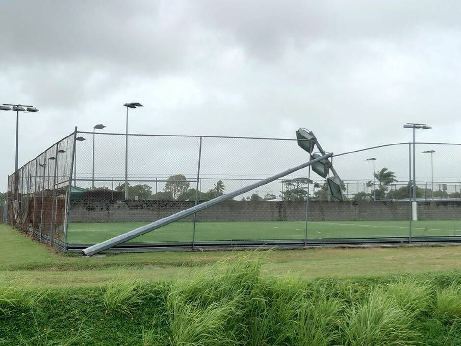 One of the floodlights at Mackay's hockey fields was knocked over as the cyclone approached the coast. Picture: Craig Ord