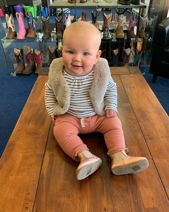 A young customer trying on a pair of new boots. Picture: Flinders Rural