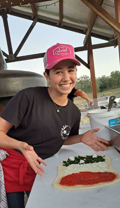 Camilla Cicchelli works hard in the kitchen, preparing wood fired pizzas for customers. Picture: Mount Jukes Family Farm