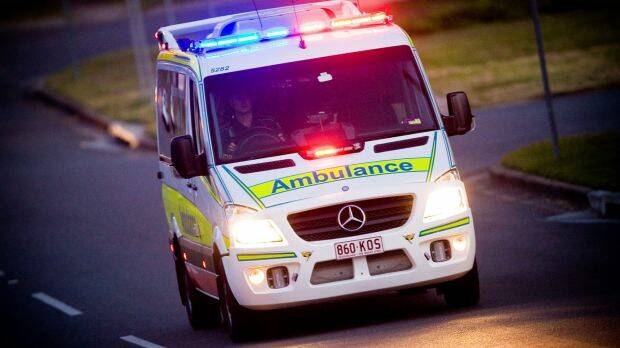 Paramedics treated the two men at the scene after they were rescued from flood waters. 