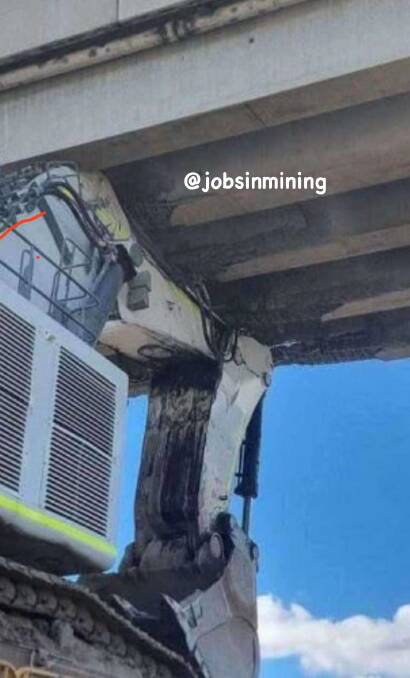 The truck has been stuck under the bridge since April 20. Picture: Jobs in Mining Facebook