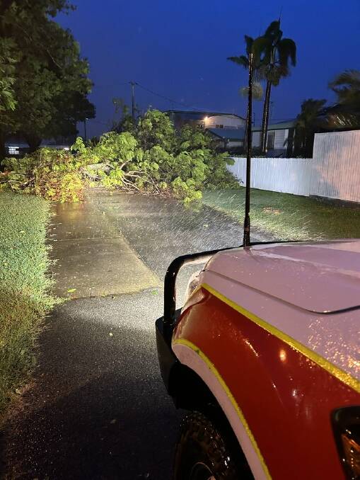 Emergency services were out keeping Townsville residents safe on January 25, surveying the damage of fallen trees and powerlines across the city. Picture: QAS