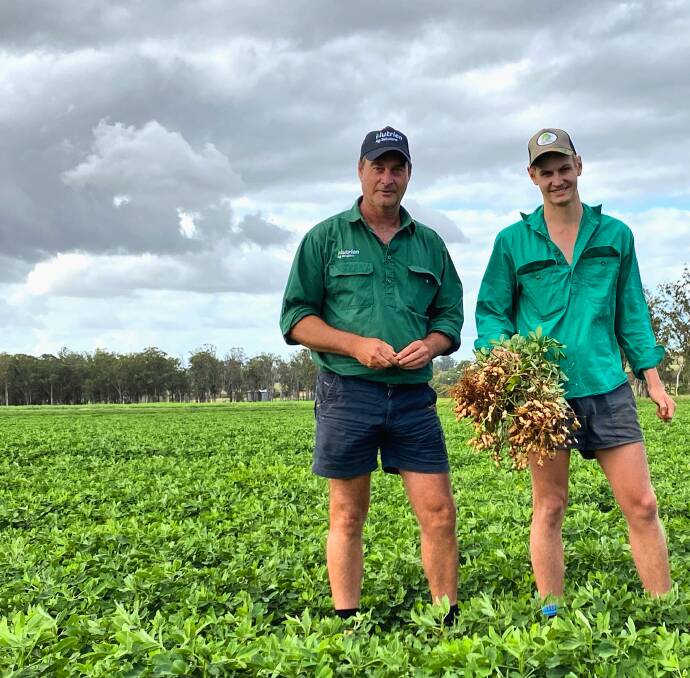 Brad and Kayden Hussey with their peanut crop. Picture: Kelly Mason 