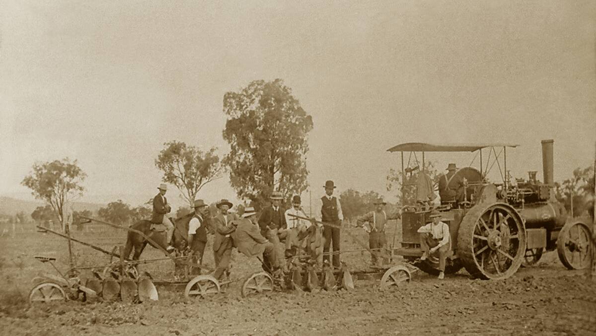 FIELD DAY:  JT Maunder driving a steam tractor to demonstrate new tandem ploughs at a field day near Pallamallawa NSW, 1916. Photo: Copyright Maunder Family