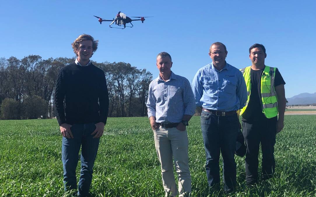 FLYING HIGH: University of Sydney precision weed control scientist Guy Coleman with director of weed research Michael Walsh, PBI director for northern agriculture Guy Roth, and XAg's Charles Chow demonstrating a precision spray drone.