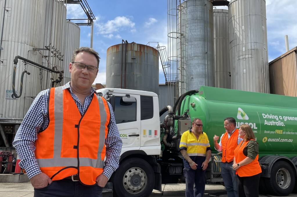 Auscol business manager, Michael McGuire, at the company's oldest receival and processing site at Riverstone in NSW, with vehicle operator, Ty Cahill; national sales manager, David Crane, and national operations manager, Kylie Green. Photo Andrew Marshall.