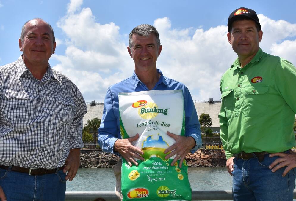Burdekin rice grower Allan Milan with Queensland's LNP Deputy Leader Tim Mander and SunRice operations manager Peter McDonnell after the Opposition party's mill funding promise.