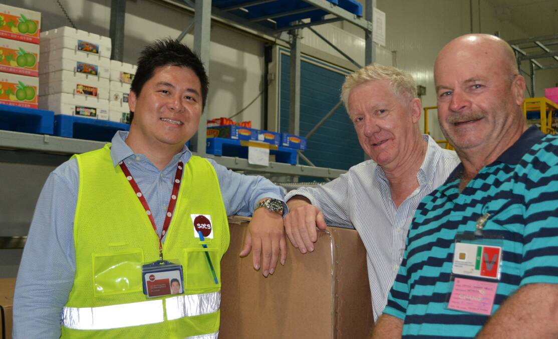 Coolport operations manager, Perry Lim, with David Sackett, Growth Farms Australia and Steve Angwin, Warranella, Wagin, Western Australia inside one of 18 cool storage warehouses for temporary storage of transhipped perishables at Changi airport.
