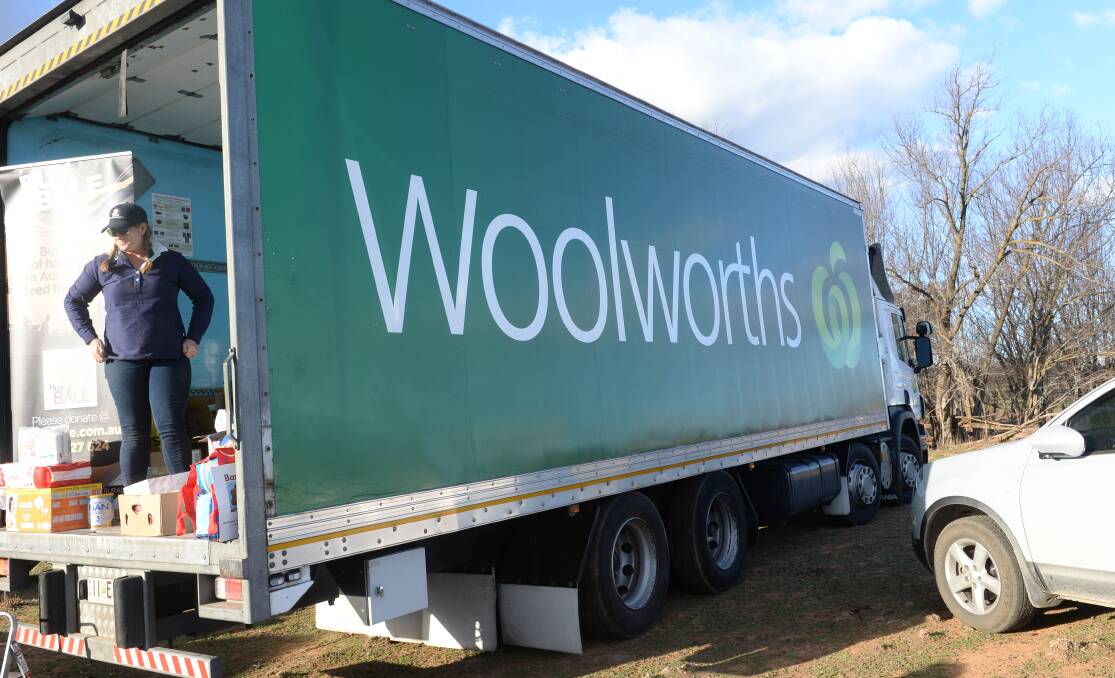 Woolworths-donated dry grocery goods being distributed at Cumnock in Central West NSW last year.