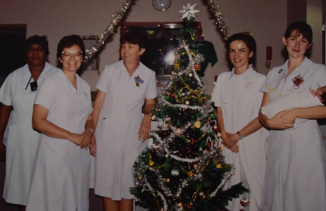 Third in from the right, Elaine McArthur celebrates Christmas at Katherine Hospital in 1993. 