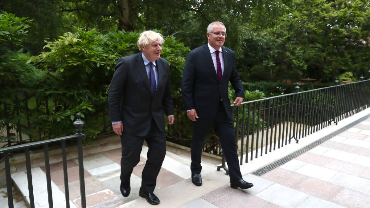 SIGNED: UK Prime Minister Boris Johnson with PM Scott Morrison in London.