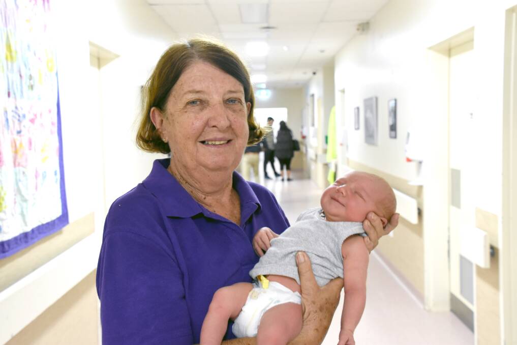NEXT STEP: Retiring today, Elaine McArthur, holding newborn Savannah Winn at Katherine Hospital, leaves behind a legacy of support, patience and kindness. 