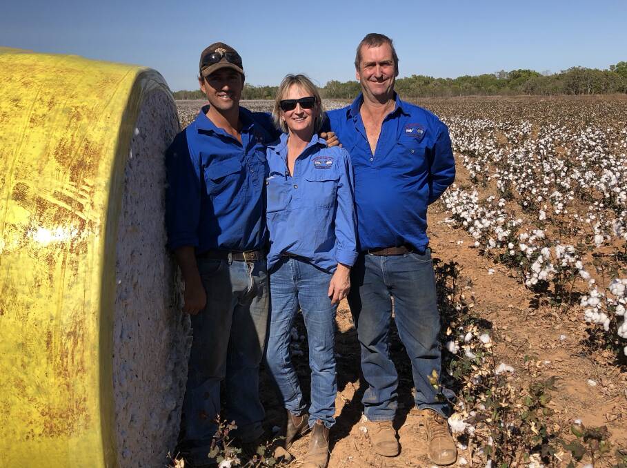 GROWS WELL HERE: Nick Black, Maya Black and Steve Black stand with one of the many bales of cotton successfully grown on their their station about 50km outside of Katherine this year. Picture: Supplied.