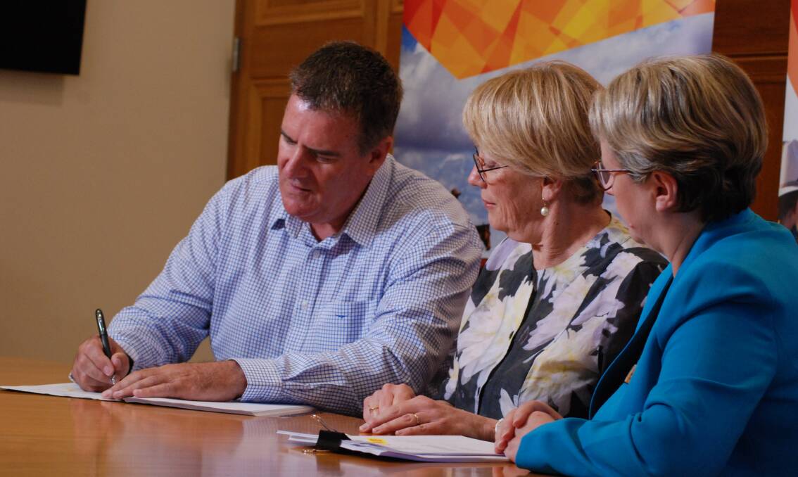 Queensland agricultural minister Mark Furner signing off on funding for the Northern Australian Climate Project.