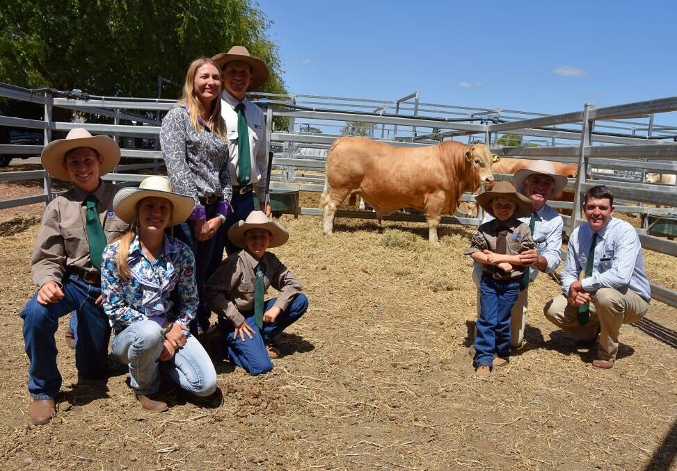 Top price bull buyers, Les and Trent Marshall, Greenfields Charbrays, Jambin with young Samuel Ford and vendors Trevor and Lolita Ford plus their other children Daniel, Chloe and Liam.