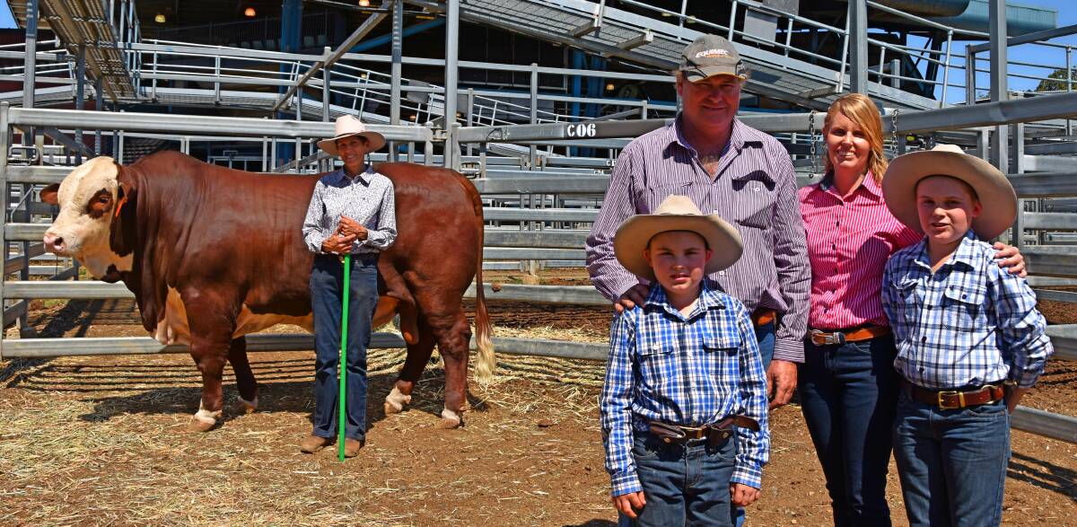 Top priced $28,000 bull, Carinya Treaty, with vendor Jackie Amor and bull buyers Paul and Janeice Anderson with sons Gavin and Travis, Eureka Grazing, Alpha. 