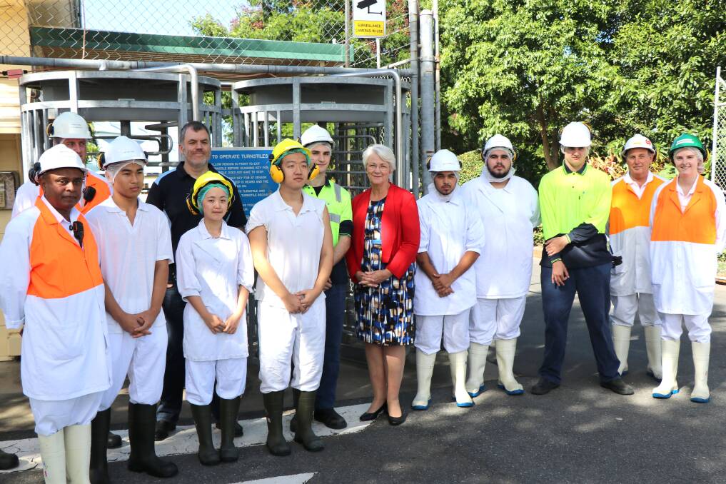 Rockhampton Regional Council mayor Margaret Strelow joins Teys Rockhampton manager Wasantha Mudannayake and Teys corporate services general manager Tom Maguire with workers who recently joined Teys Lakes Creek plant.