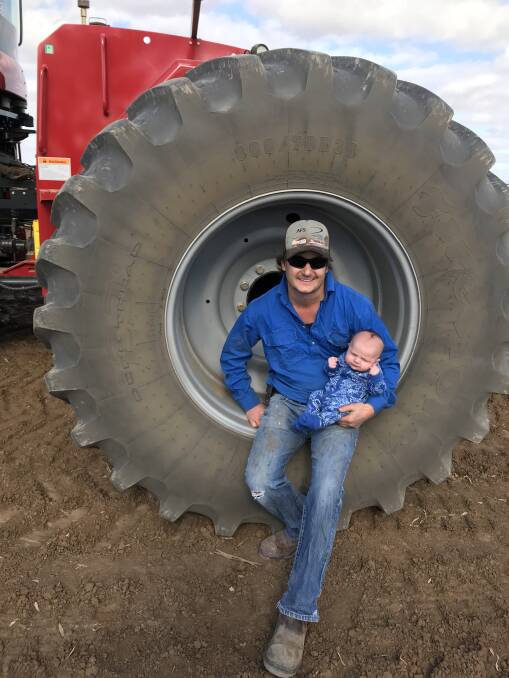 WHEELS TURNING: Cam Parker with son Freddie. Mr Parker believes agriculture presents a range of opportunities and says down the track he would like to own and operate a farm. Photo by Amanda Parker.