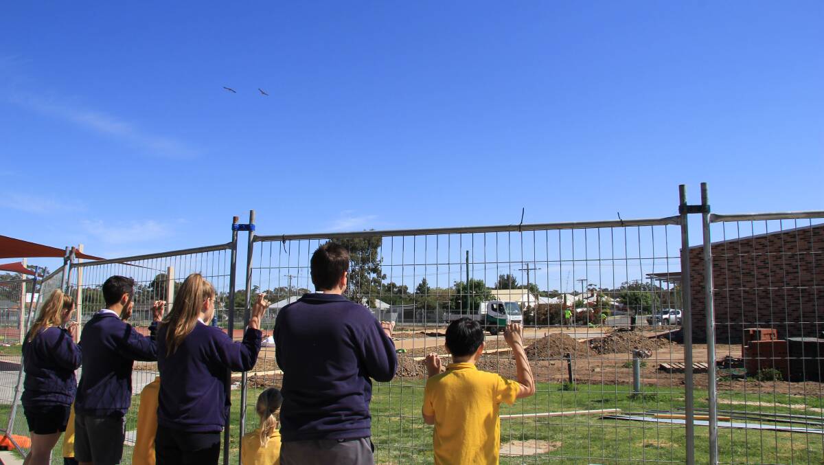 Students at Warracknabeal Primary School look over at unfinished work at the Warracknabeal Education Precinct.