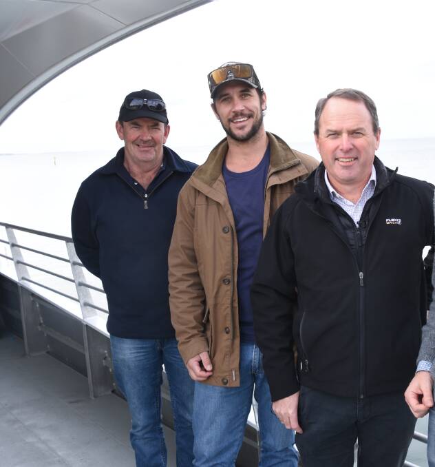 PADDOCK TO PLATE: Northern Victorian growers Rick Lang, Charlton and Jarrod Kemp, Nullawil, and Steve Cameron, Flexi Grain, take a look at the Wisteria being loaded at the Port of Geelong last month.