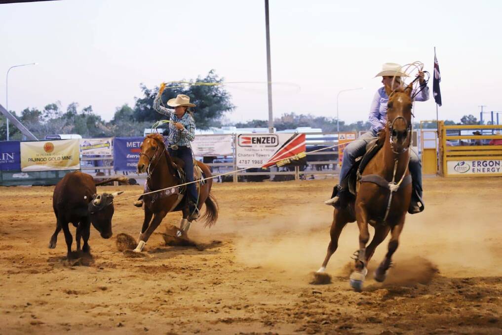 Teamwork: Bridie Davison and Shaye Land working in unison during the team roping event at the 2018 Dust 'N' Gold Rodeo. Photo courtesy of Di Anderson Photography.