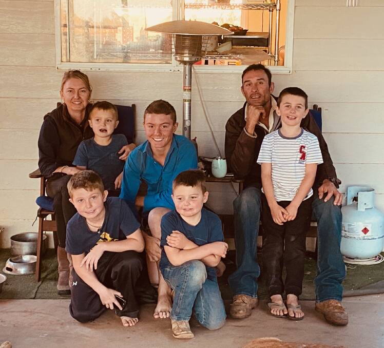 Family time: Grant and Rebecka Wells with their children at home on Elrose, Boulia, their base of operations for their commercial breeding operations. 