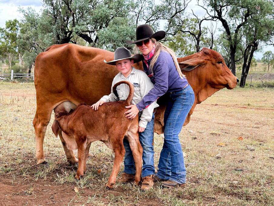 Zoe Corrie with her son P.J. in the paddock on the family's property in Gracemere.