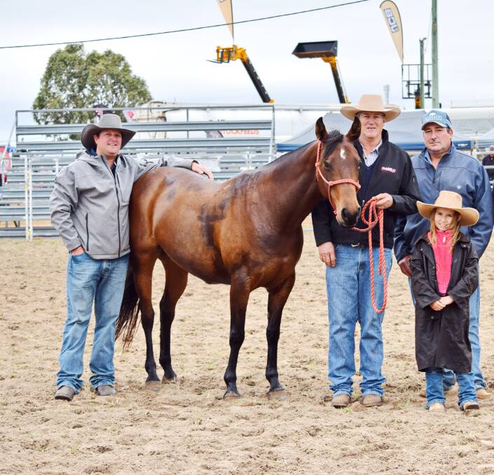 Marvellous mare: Cody O'Neill, vendor Tim Olive, buyer Simon Camm, and daughter Harriet, with Kooloombah Melody, the 2021 sale's top price lot.