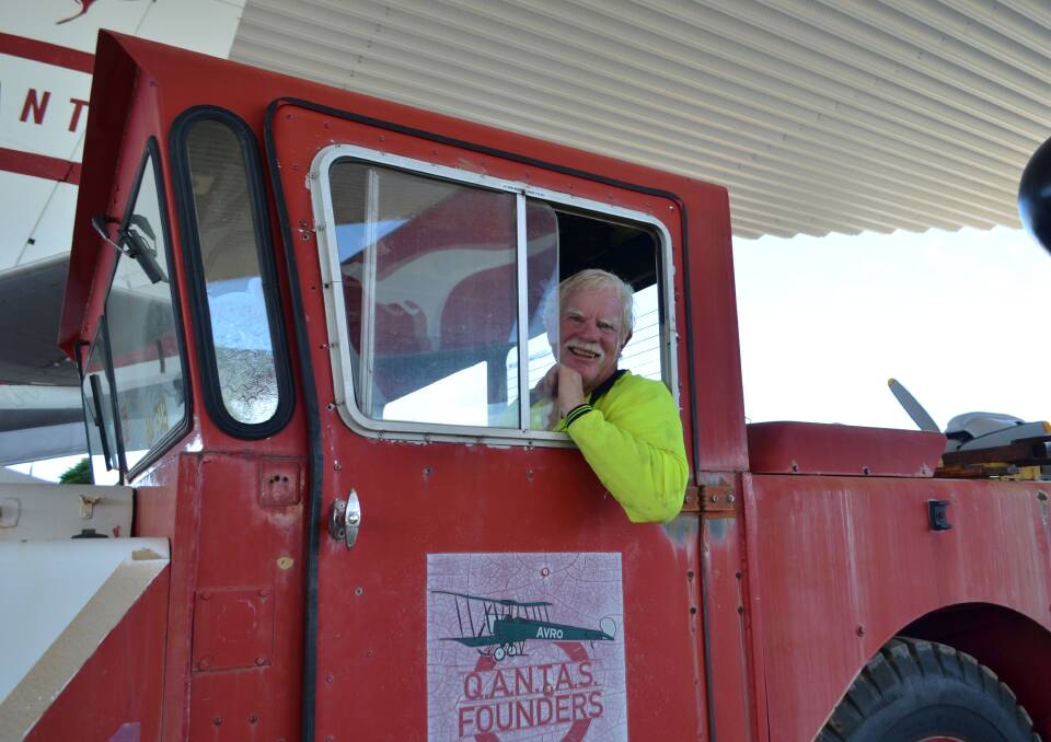 Volunteer Greg Boyce who has been involved in the project since 2014, at the wheel of the museum's vintage aircraft tug truck.
