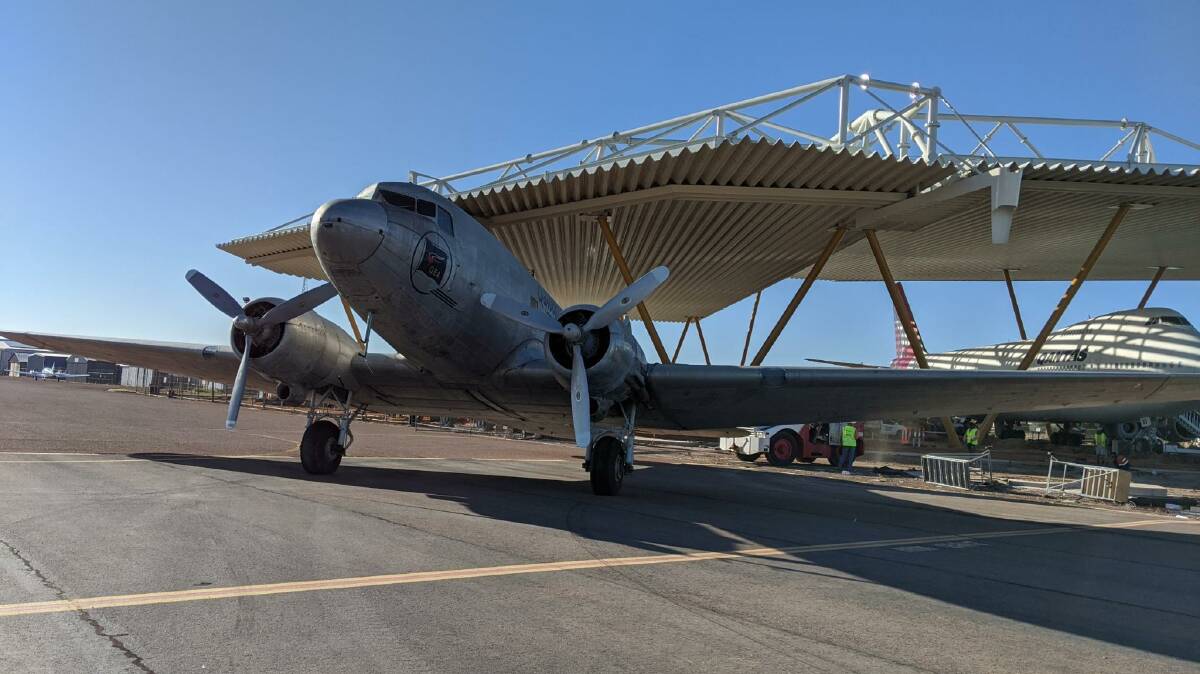The Qantas Founders Museum's DC3 being moved into position under the airpark roof.