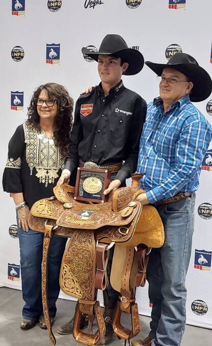 World champion bull rider Ky Hamilton showing off his gold buckle, alongside his parents Sharell and Michael Hamilton at Las Vegas. Picture supplied.