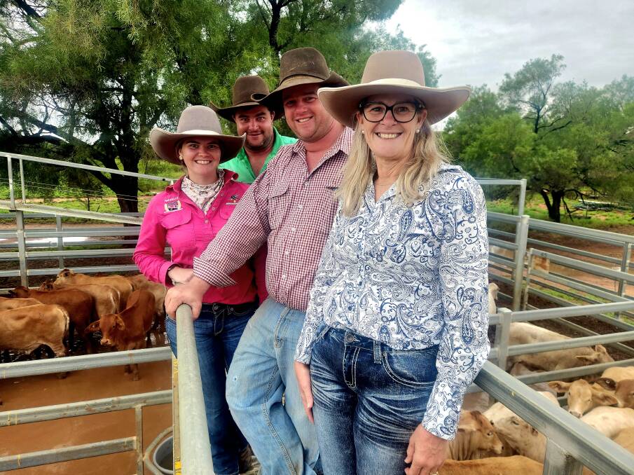 Surat's Joh Hancock, right, with Rachelle Sizer and Michael Hancock, Townsville, and Nick Hancock, Moonya, Barcaldine, keeping an eye on prices at the sale. Picture: Sally Gall