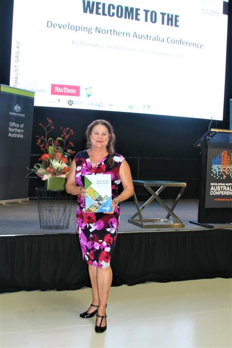 Developing Northern Australia CRC chair Sheriden Morris with a copy of the State of Northern Australia report released in time for the conference at Rockhampton.
