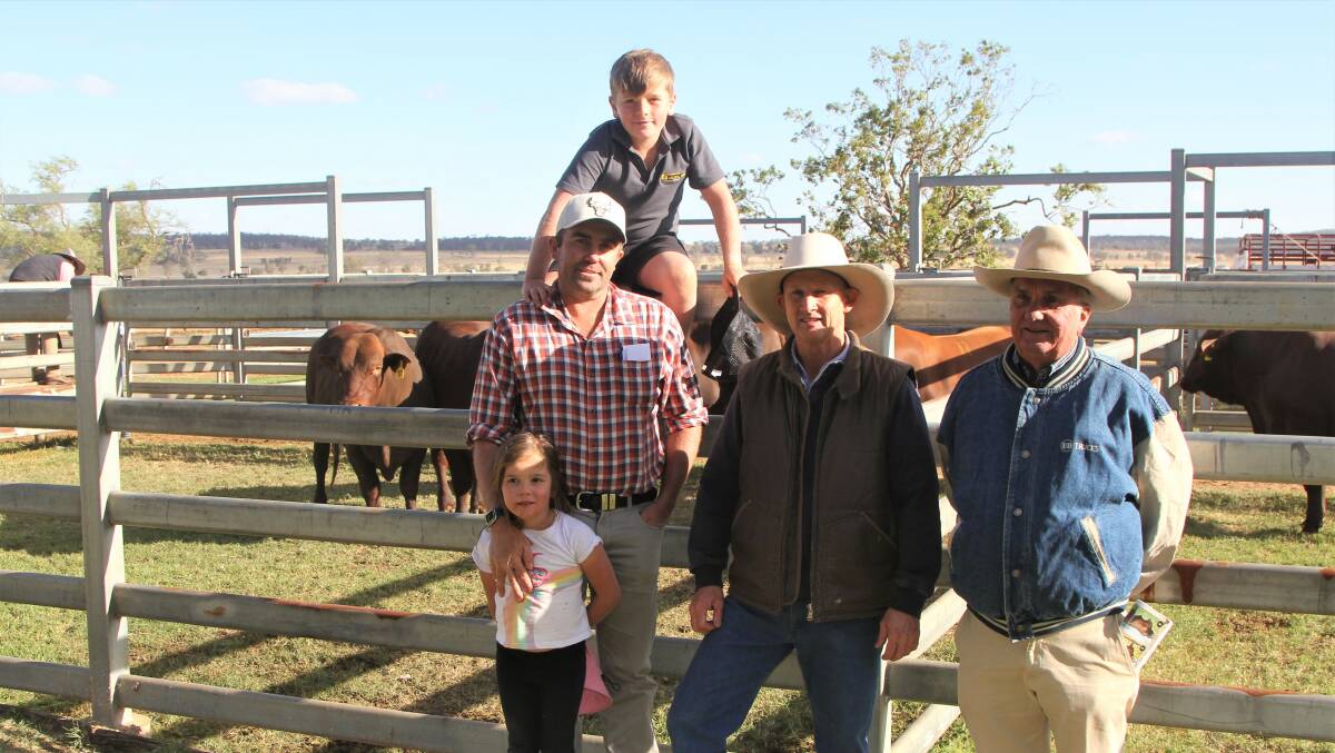 Jason Goodland and his children Ivy and Olly, and Geoff Goodland, Wightfields Santa Gertrudis Stud, Wandoan, the purchasers of the top-priced bull with vendor David Greenup, second right. Photos - Sally Gall.