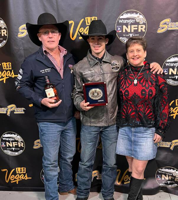 Champion Australian saddle bronc rider Damian Brennan, centre, in Las Vegas with his parents Peter and Maree, over from Injune for the national finals. Picture supplied.