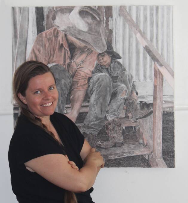 Hughenden artist Katie Jones with one of her pieces in the Games That We Play exhibition in Townsville. Picture supplied.