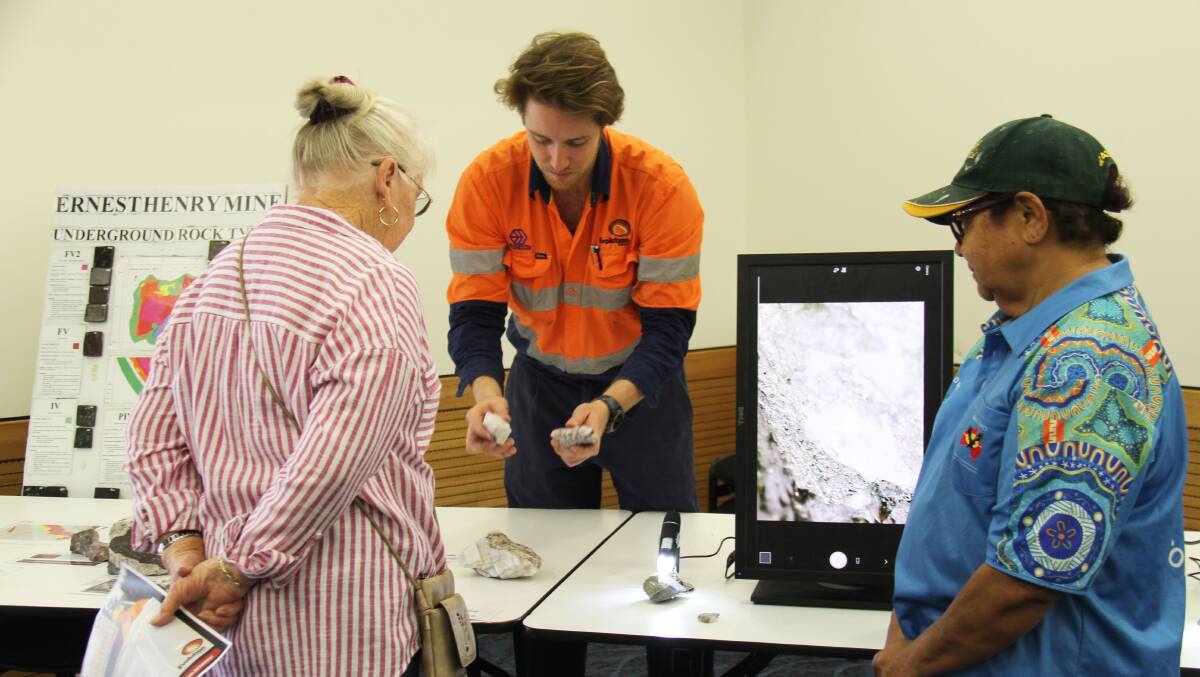 EHO graduate geologist Adam Wright showing community members the different rock types.