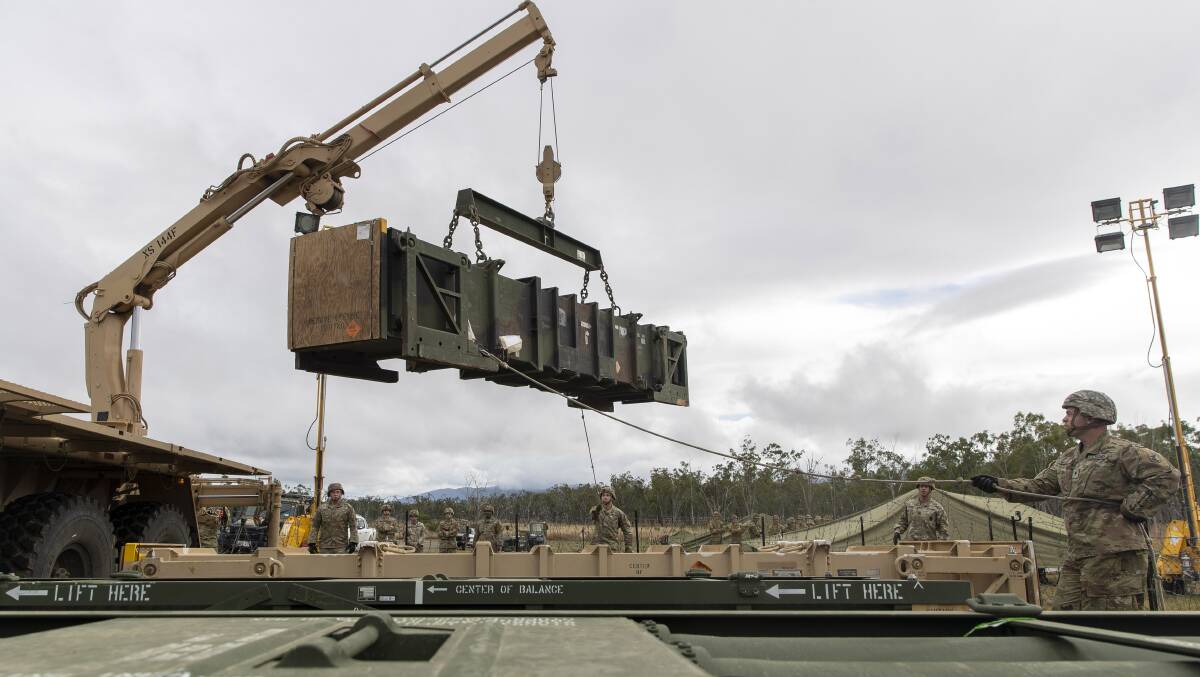 A United States Patriot Missile is loaded onto a guided missile transporter vehicle, prior to a live fire practice at Shoalwater Bay, during Exercise Talisman Sabre 2021. Photo - Pte Jacob Joseph.