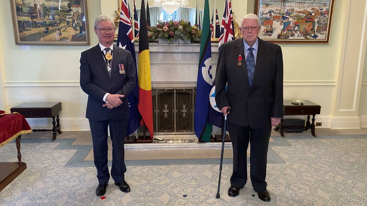 Bravery honoured: Queensland Governor Paul de Jersey AC presenting Robert Pickersgill's Bravery Medal to his son Doug Pickersgill at Government House in Brisbane last Friday. Picture: supplied.