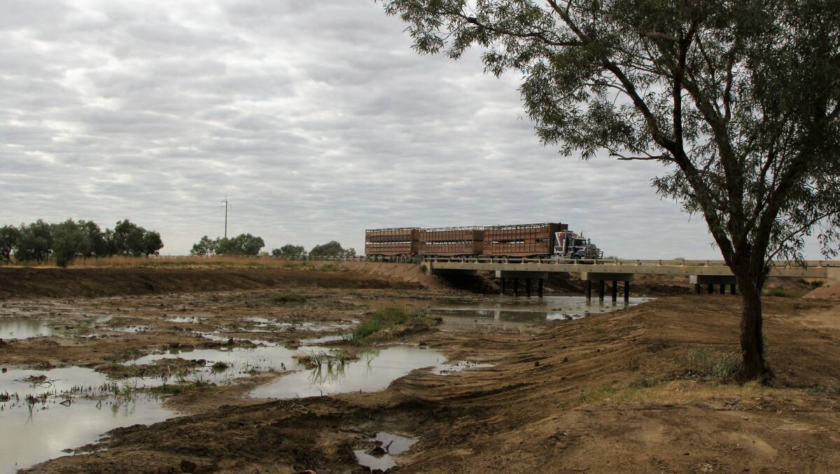 Silt was being dredged out of flooded creeks months after February's monsoon event. This bridge is on the eastern end of Julia Creek. Picture - Sally Cripps.