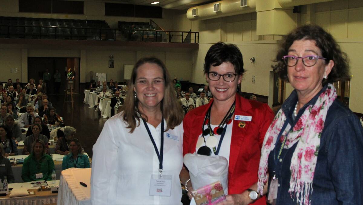 ICPA vice presidents, Tammie Irons and Louise Martin flank their retiring president, Kim Hughes, following a presentation made at the Winton state conference.