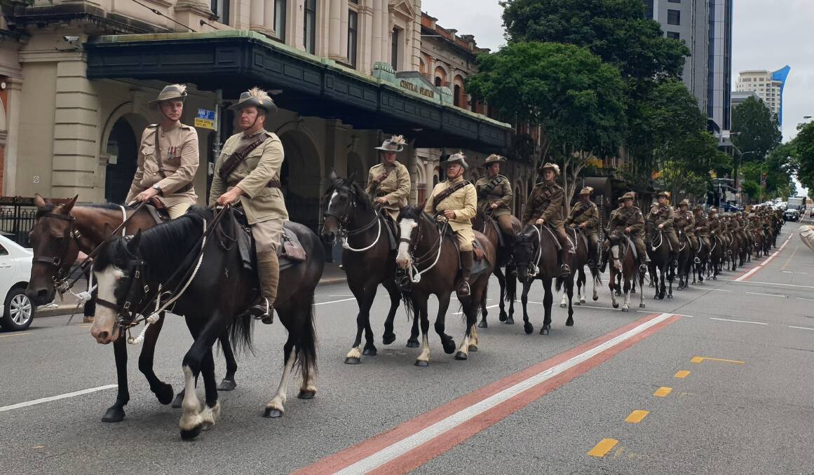 The parade passing through the streets of Brisbane on Sunday, led by the commanding officer of the Light Horse Regiment, Lieutenant Colonel Tom McDermott CSC DSO. Pictures - Sally Gall.