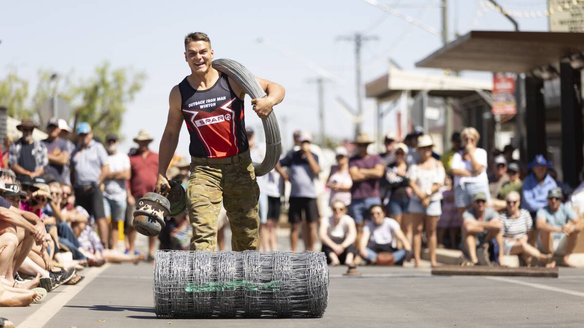 A competitor in the obstacle course in the main street.