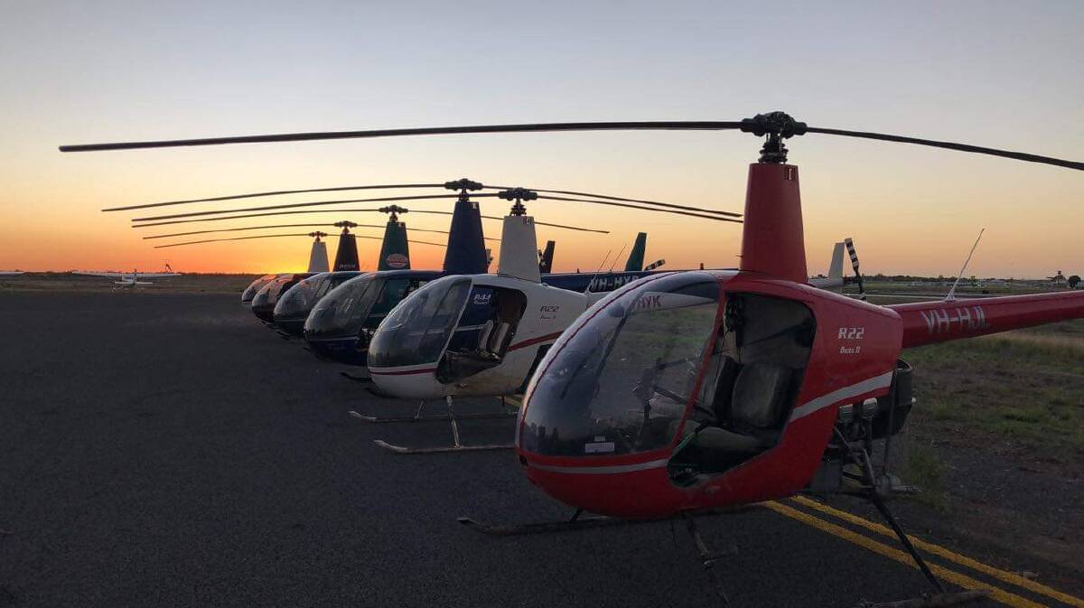 Some of the 16 helicopters waiting for dawn and another day's work helping people deal with the monsoon. Picture - Bec Gunther.