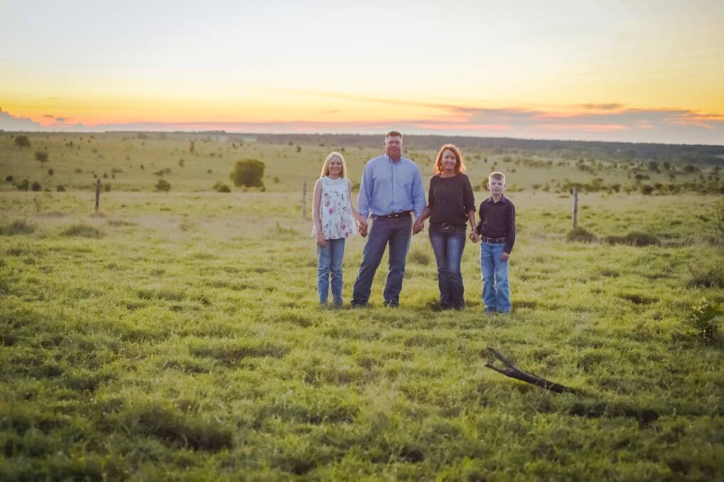 Tony and Louise Prentice and their children Lucy and Will haven't seen grass as plentiful as this for some years at their Emerald property. Photo: Kelly Butterworth