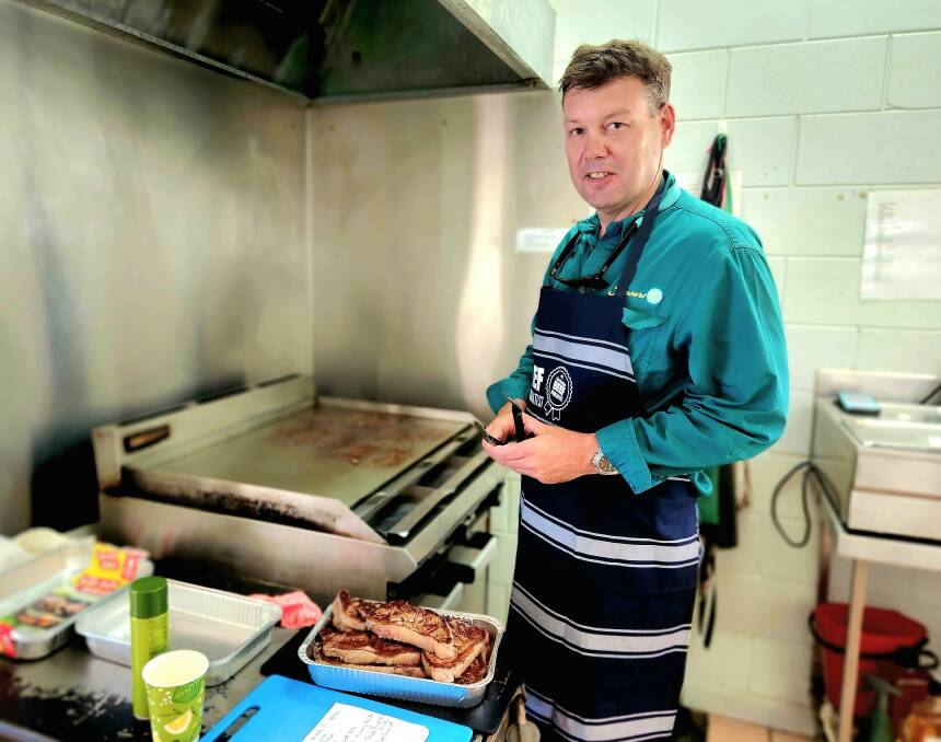 Frasers central Queensland manager Athol Carter swaps the steering wheel for barbecue tongs at the workshop.