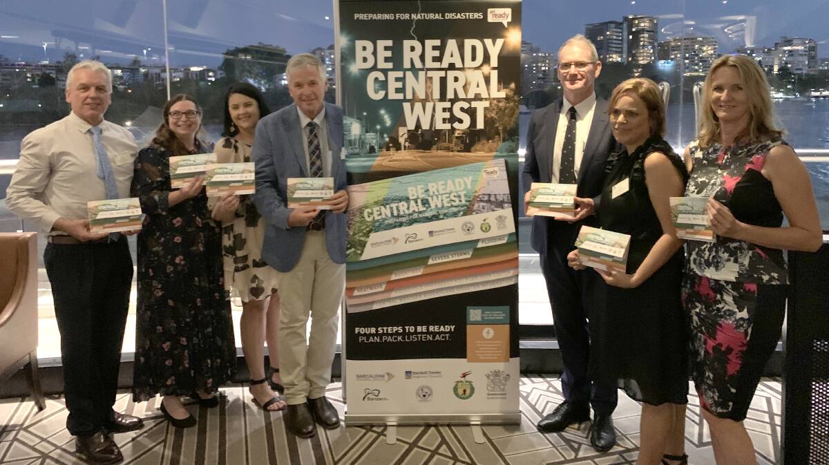 Craig Neuendorf, Angela Waugh, Melissa Doyle, Cr Tony Rayner, Queensland Reconstruction Authority CEO Brendan Moon, Donna Rowlands and Andrea Saunders at the flipbook's launch in Brisbane. Picture supplied.