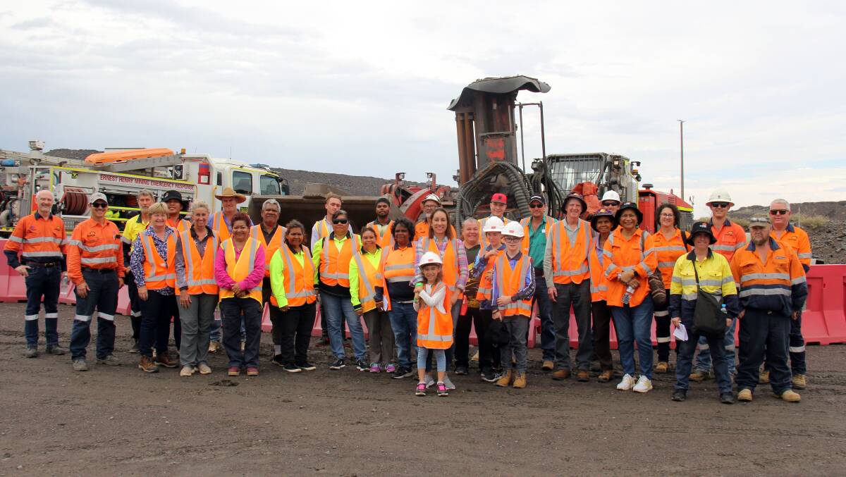 Afternoon tour attendees pose for a photo with Ernest Henry Operations volunteers. Pictures: Supplied