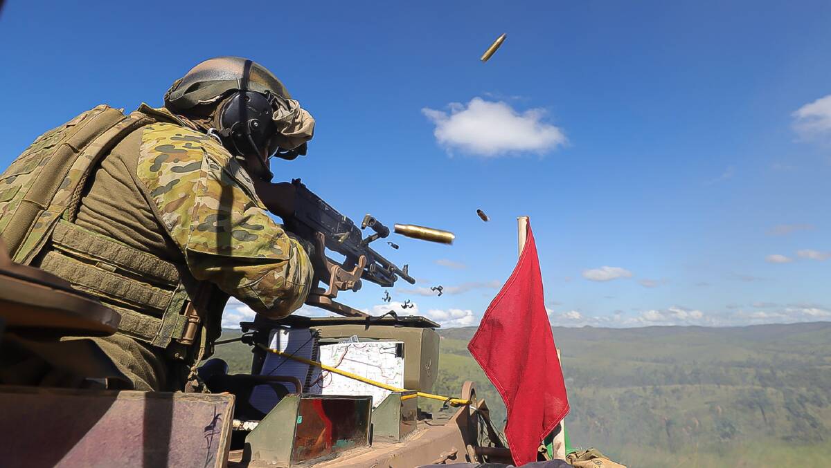 An Australian Army soldier from the 2nd Calvary Regiment conducts a live fire training serial with a mounted MAG58 Machine Gun in an Australian Light Armoured Vehicle at the Townsville Field Training Area. Picture: LCPL Riley Blennerhassett